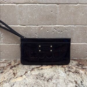 Kate Spade Black Patent Leather Wristlet with classic embossed KS print